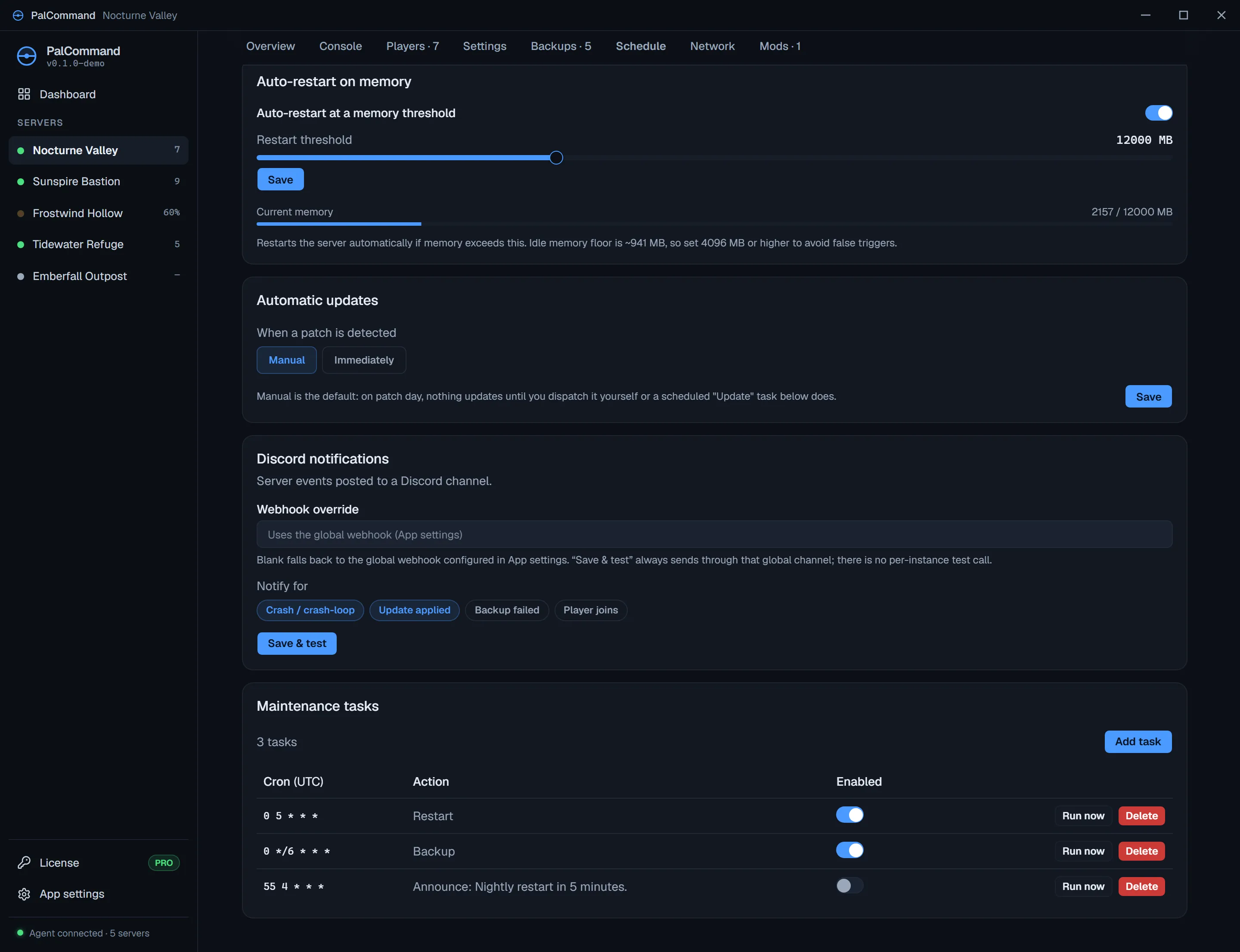 The Schedule tab of one server, top to bottom: an "Auto-restart at a memory threshold" card with the restart threshold slider set to 12000 MB, current memory reading 2157 of 12000 MB, and a note that the idle memory floor is about 941 MB so 4096 MB or higher avoids false triggers; an update-policy card set to Manual, explaining that nothing updates until you dispatch it yourself; a Discord notifications card with per-event toggles; and a maintenance-task table of three cron entries in UTC for Restart, Backup and an Announce.